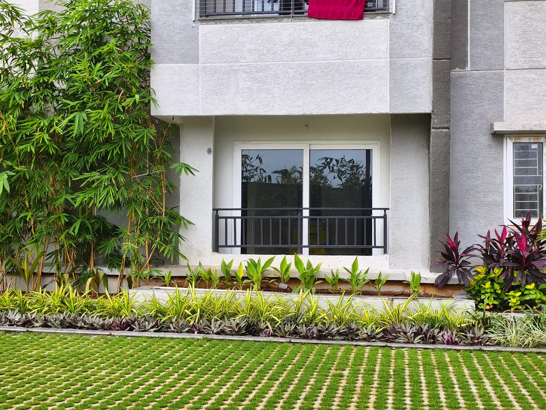 Ground floor residence beside landscaped greenery